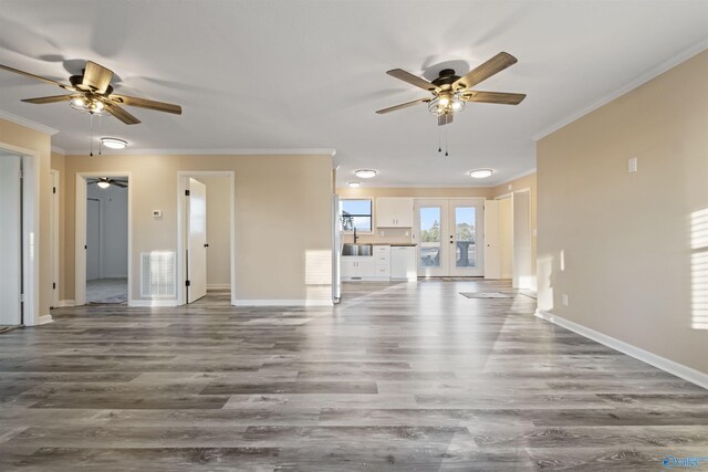 615 County Road 40, Centre, AL 35960 - unfurnished living room featuring french doors, a ceiling fan, a sink, and crown molding