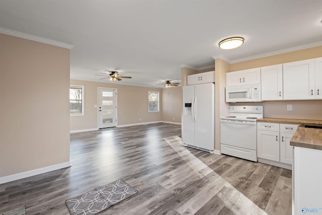 615 County Road 40, Centre, AL 35960 - kitchen with white cabinetry, wood finished floors, crown molding, and white appliances