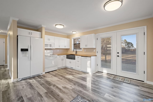 615 County Road 40, Centre, AL 35960 - kitchen featuring white appliances, white cabinets, light wood-style floors, and french doors