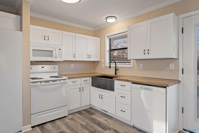 615 County Road 40, Centre, AL 35960 - kitchen featuring crown molding, white appliances, wooden counters, white cabinetry, and a sink