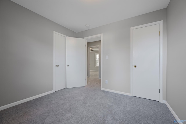 unfurnished bedroom with carpet flooring