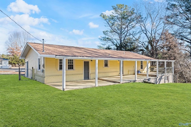 back of house with a yard and a patio area