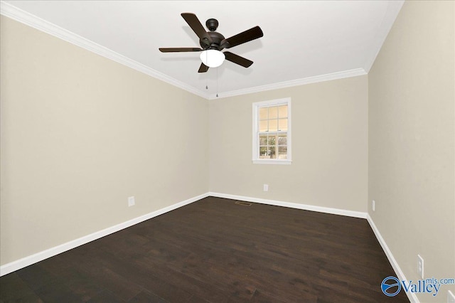 spare room with visible vents, baseboards, a ceiling fan, dark wood finished floors, and crown molding