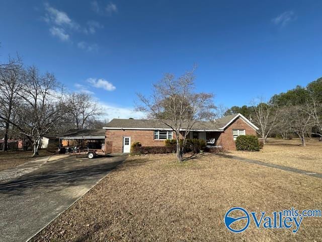 ranch-style home with a carport