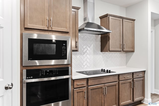 6228 Pisgah Dr NW, Huntsville, AL 35810 - kitchen featuring oven, wall chimney exhaust hood, built in microwave, black electric cooktop, and decorative backsplash