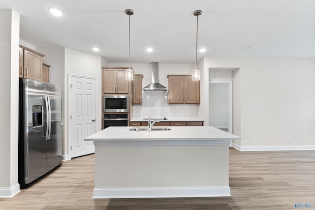 6228 Pisgah Dr NW, Huntsville, AL 35810 - kitchen with stainless steel appliances, wall chimney exhaust hood, a sink, light wood-type flooring, and tasteful backsplash