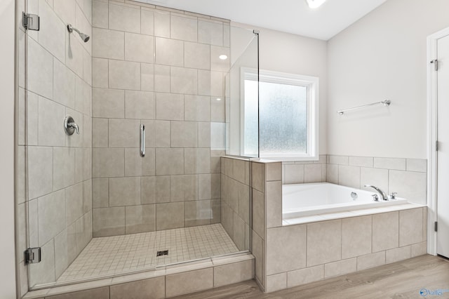 6228 Pisgah Dr NW, Huntsville, AL 35810 - bathroom with a shower stall, a garden tub, and wood finished floors