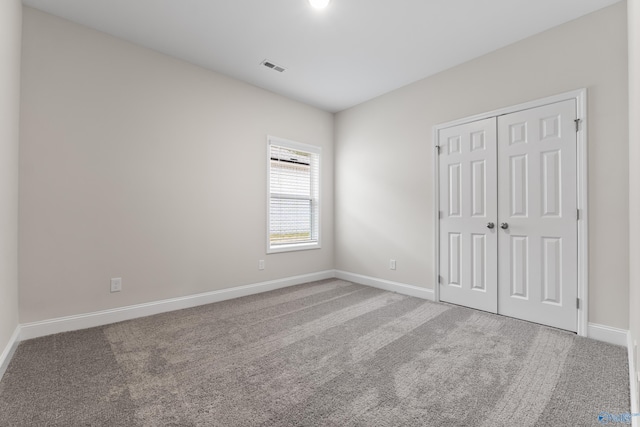 6228 Pisgah Dr NW, Huntsville, AL 35810 - unfurnished bedroom with baseboards, carpet, and a closet