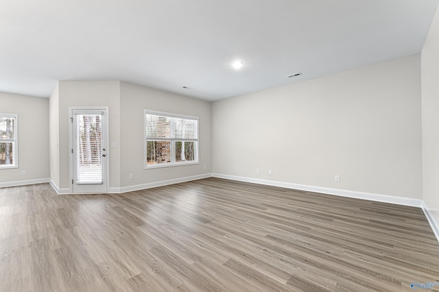 6228 Pisgah Dr NW, Huntsville, AL 35810 - unfurnished living room featuring wood finished floors and baseboards