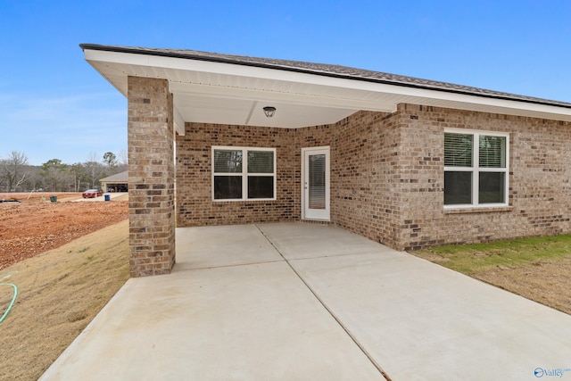 6228 Pisgah Dr NW, Huntsville, AL 35810 - view of front facade with a patio area and brick siding
