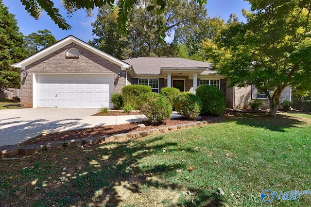 single story home featuring a garage and a front lawn