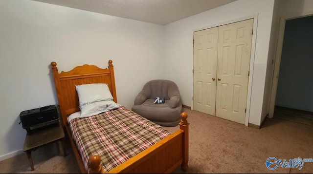 carpeted bedroom with a closet