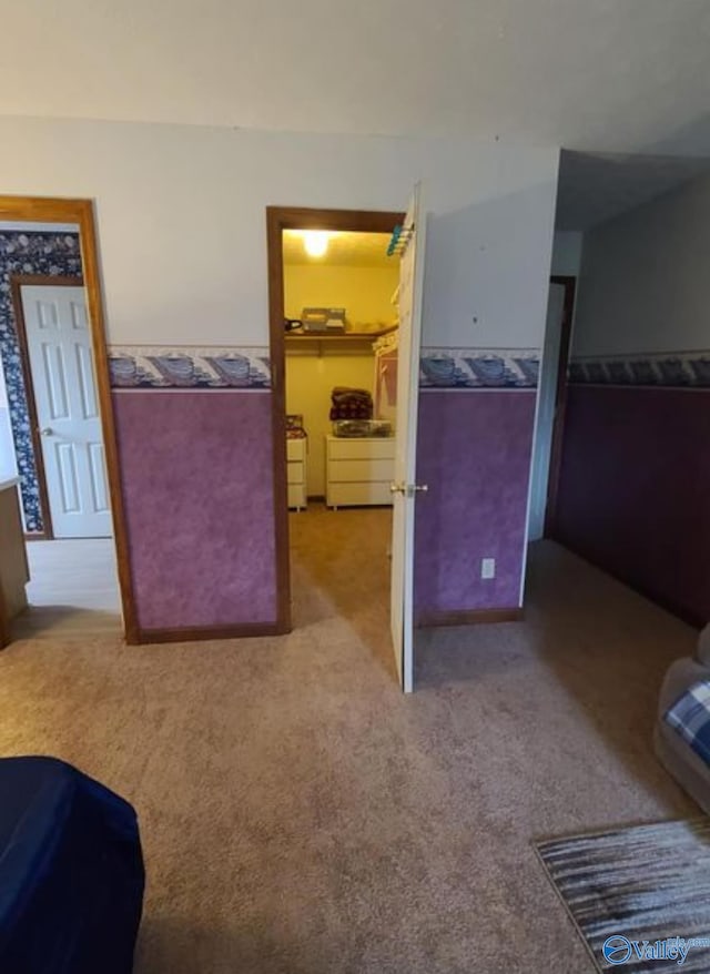 bedroom featuring light colored carpet