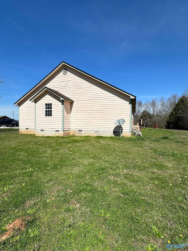 view of side of home featuring a yard