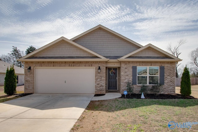 view of front of home with a garage, brick siding, concrete driveway, and a front lawn