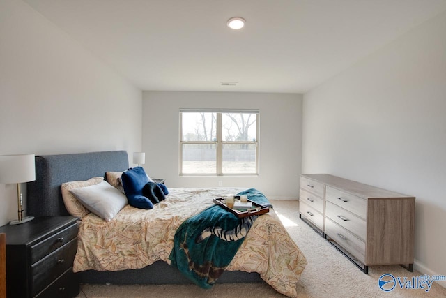 178 Meadow Ridge Dr, Hazel Green, AL 35750 - bedroom with visible vents, light carpet, and baseboards