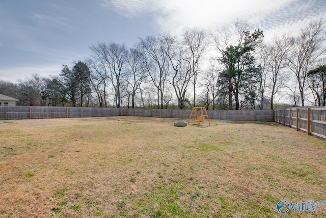 178 Meadow Ridge Dr, Hazel Green, AL 35750 - view of yard featuring a playground and a fenced backyard