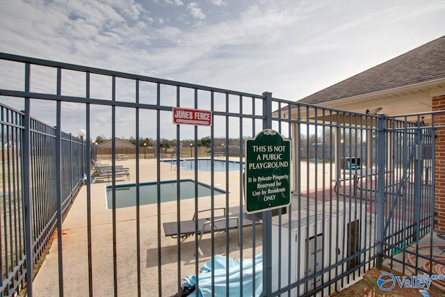 178 Meadow Ridge Dr, Hazel Green, AL 35750 - view of gate featuring fence