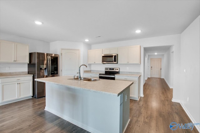 178 Meadow Ridge Dr, Hazel Green, AL 35750 - kitchen with a sink, stainless steel appliances, dark wood-style flooring, and light countertops