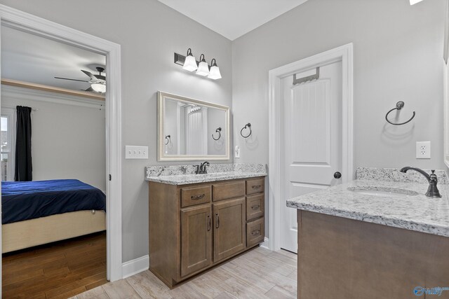 bathroom featuring ceiling fan and vanity