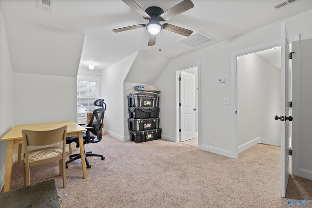 carpeted office featuring ceiling fan and vaulted ceiling