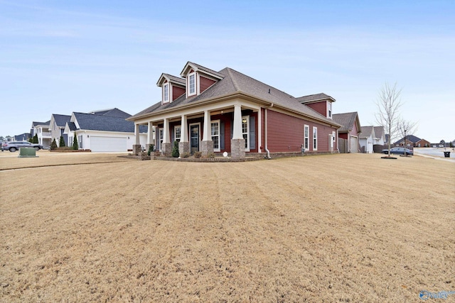 cape cod-style house with a porch and a garage