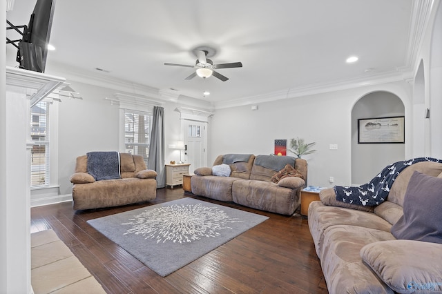 living room featuring ceiling fan, dark wood-type flooring, and ornamental molding