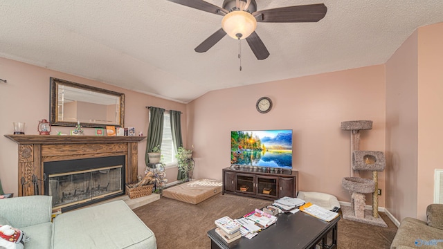 living room featuring baseboards, carpet, lofted ceiling, a glass covered fireplace, and a textured ceiling