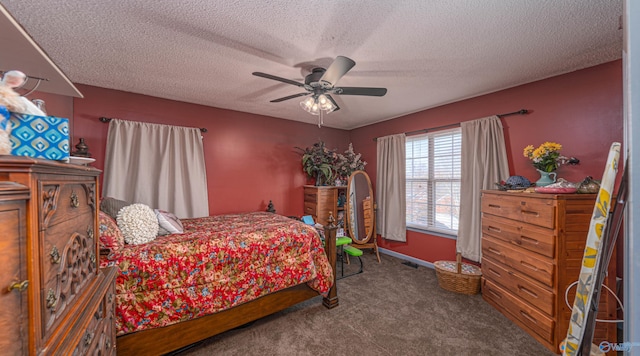 carpeted bedroom with a ceiling fan, baseboards, and a textured ceiling