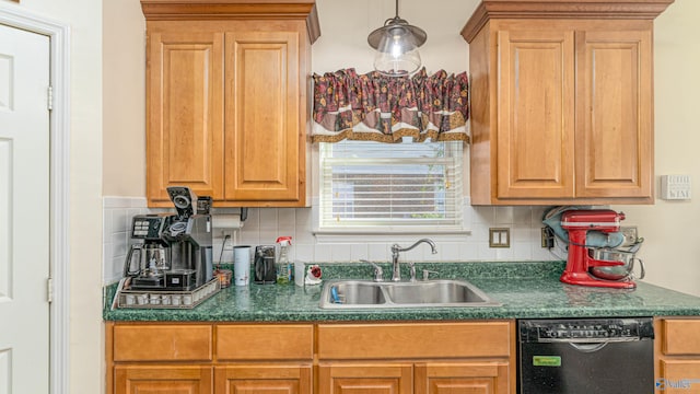 kitchen featuring dark countertops, decorative backsplash, black dishwasher, and a sink