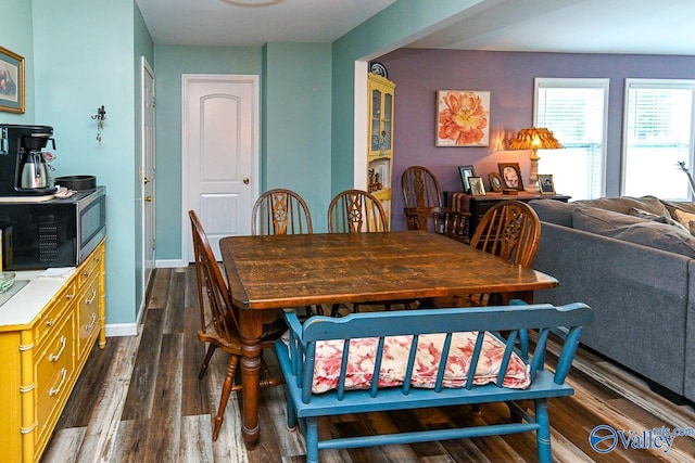 dining space featuring dark hardwood / wood-style flooring