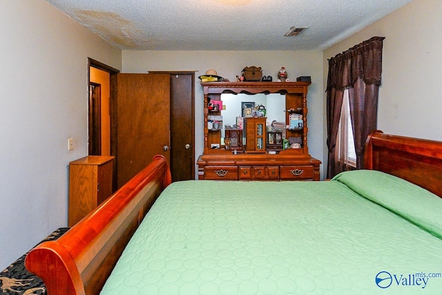 bedroom with a textured ceiling