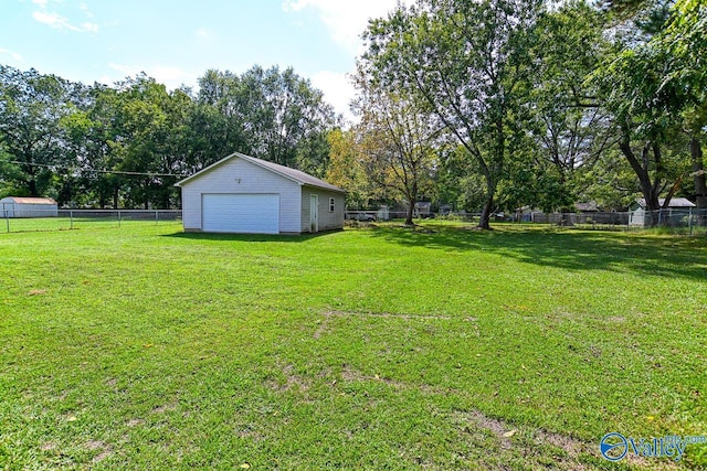 view of yard with an outdoor structure and a garage