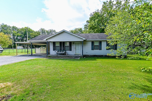 ranch-style house with a front lawn, a carport, and covered porch