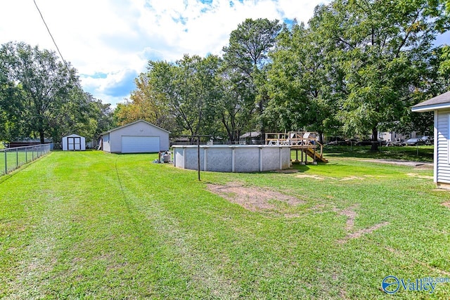 view of yard featuring a storage shed and a pool side deck