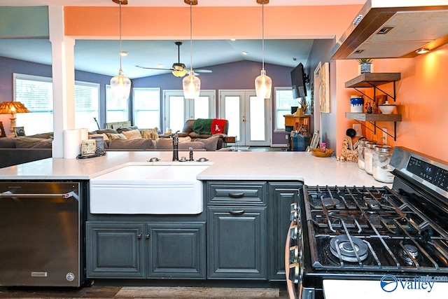 kitchen featuring pendant lighting, vaulted ceiling, ceiling fan, and black range with gas stovetop