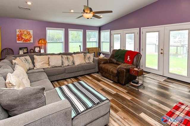 living room with wood-type flooring, lofted ceiling, ceiling fan, and french doors