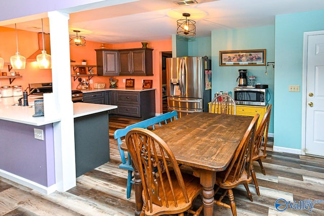 dining room featuring wood-type flooring