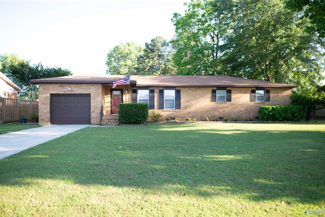 1709 Iris SW, Decatur, AL 35601 - single story home featuring an attached garage, driveway, and brick siding