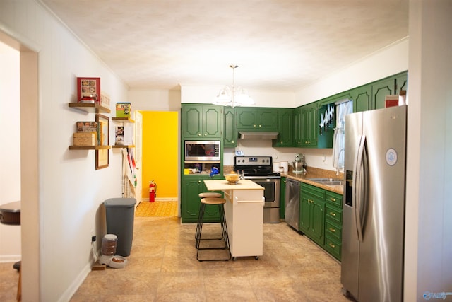 1709 Iris SW, Decatur, AL 35601 - kitchen featuring stainless steel appliances, green cabinets, a chandelier, under cabinet range hood, and ornamental molding