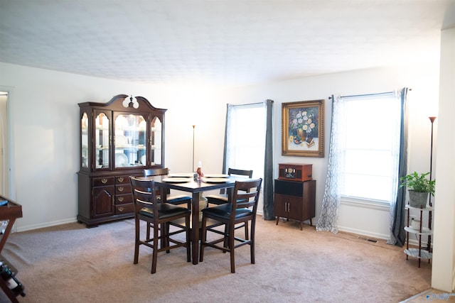 1709 Iris SW, Decatur, AL 35601 - dining area with light carpet and baseboards