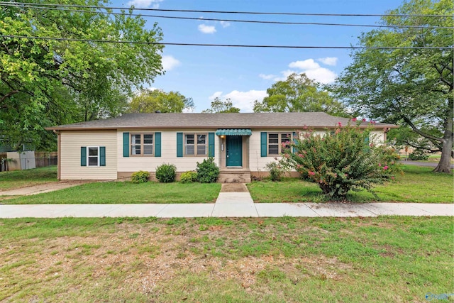 ranch-style house with a front yard