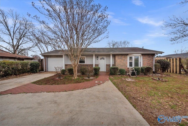 ranch-style home with brick siding, an attached garage, concrete driveway, and fence