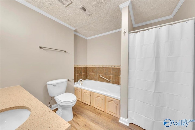 full bathroom featuring crown molding, toilet, wood finished floors, and a textured ceiling