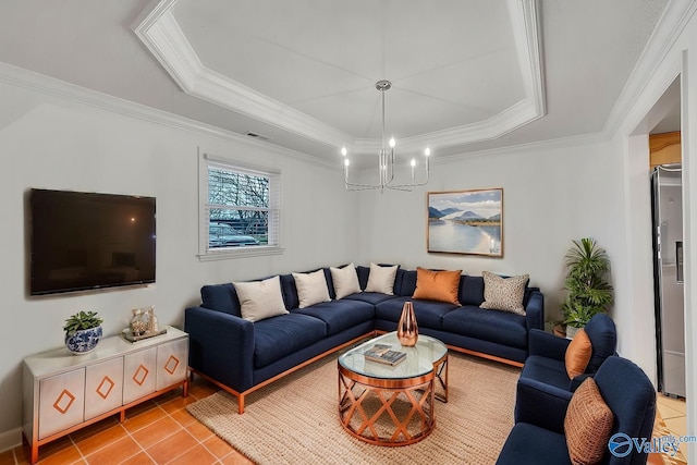 living room featuring a tray ceiling, light tile patterned floors, crown molding, and a chandelier