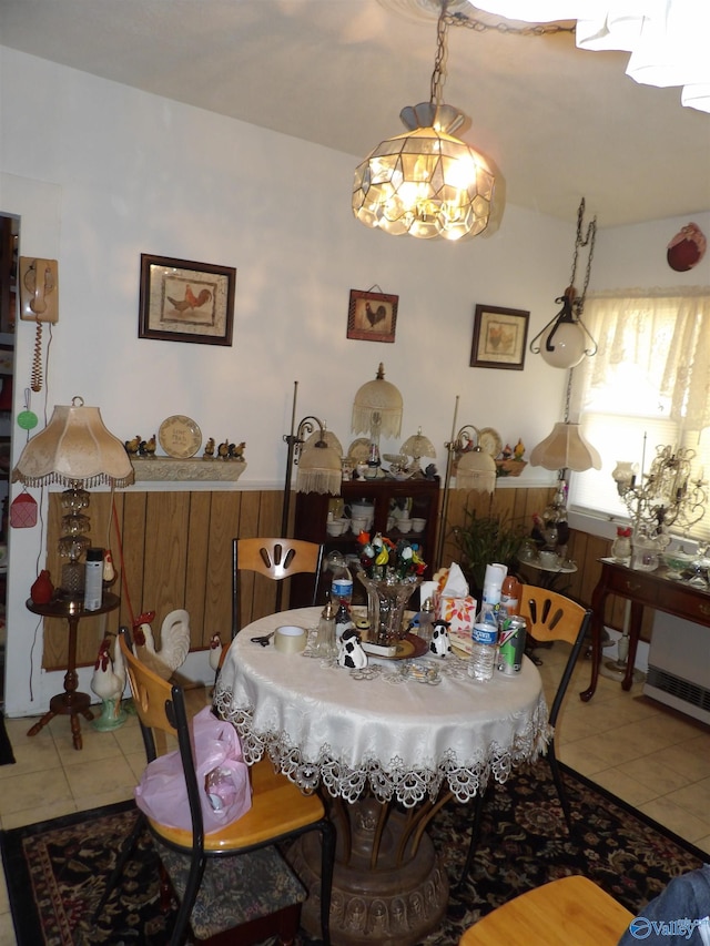 tiled dining room with wooden walls