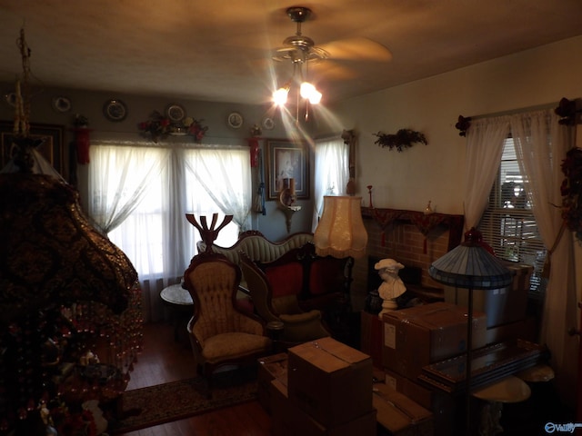 living room featuring hardwood / wood-style flooring and ceiling fan