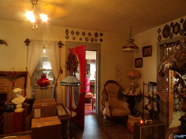 sitting room featuring ceiling fan and hardwood / wood-style flooring