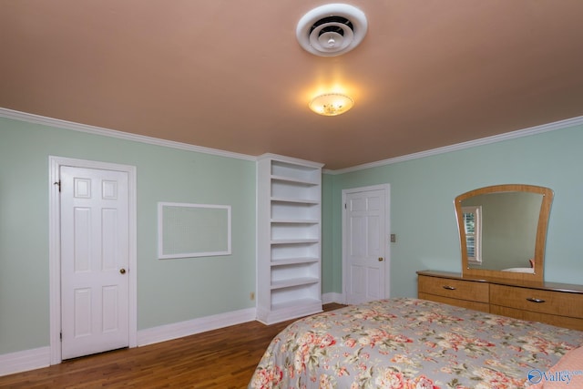 bedroom with dark hardwood / wood-style floors and crown molding