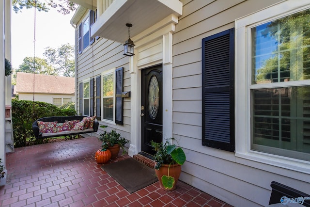 doorway to property featuring a patio area